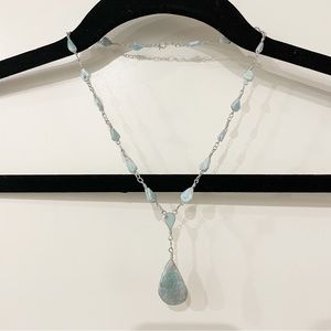Silver metal chain drop pendant necklace with light blue stones